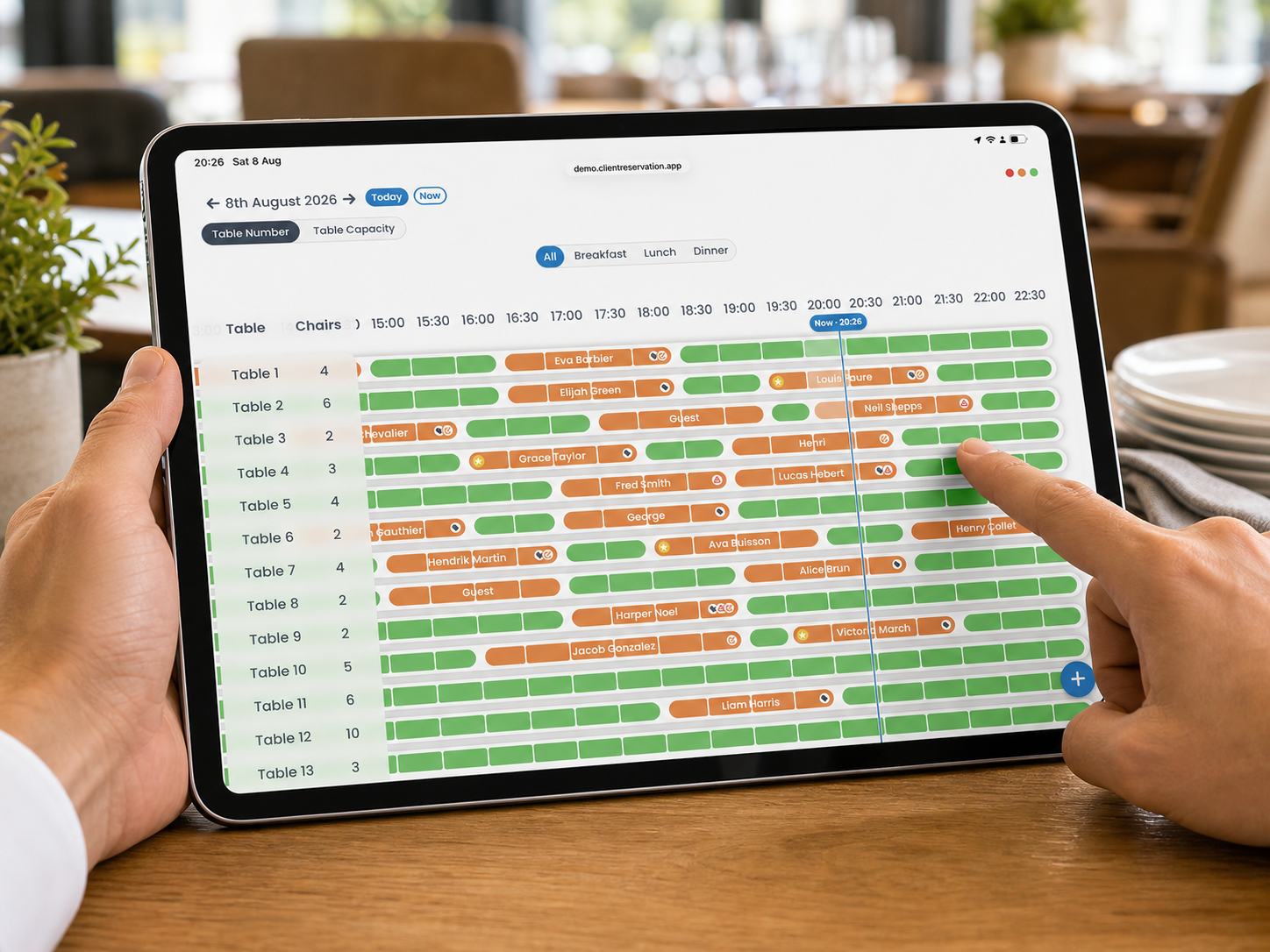 A restaurant staff member selecting an available booking time on the Client Reservation Timeline on a landscape iPad
